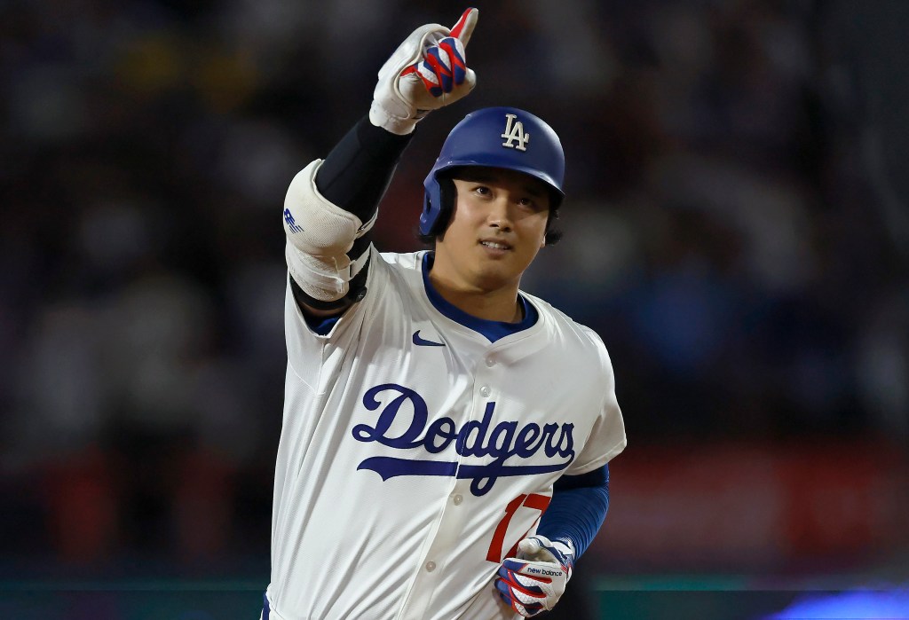 Shohei Ohtani of the Los Angeles Dodgers celebrates his 50th home run.