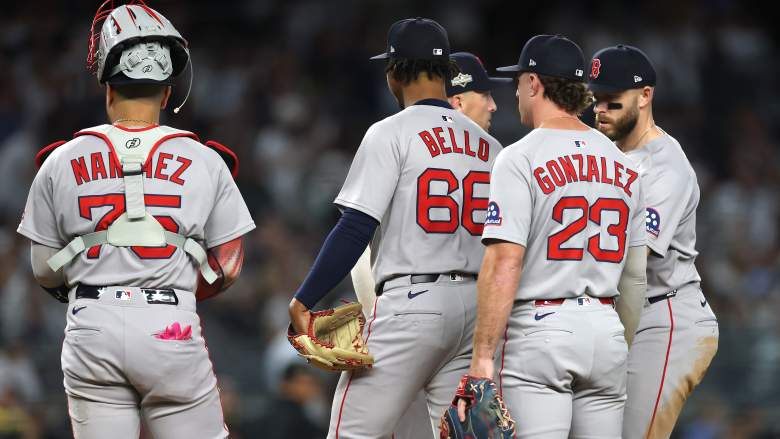 Boston Red Sox players on the field during a game ahead of Opening Day roster announcement