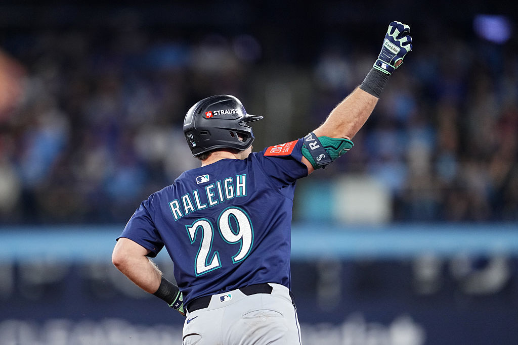 TORONTO, ONTARIO - OCTOBER 20: Cal Raleigh #29 of the Seattle Mariners rounds the bases after hitting a solo home run during the fifth inning against the Toronto Blue Jays in game seven of the American League Championship Series at the Rogers Centre on October 20, 2025 in Toronto, Ontario.
