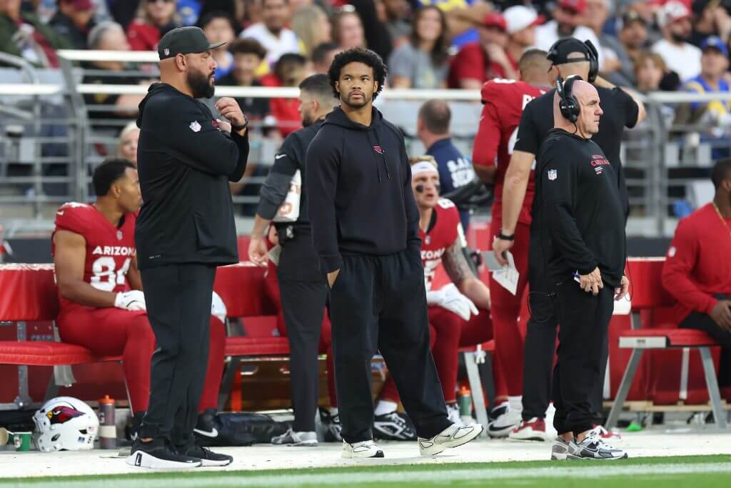 Kyler Murray looks on from the sideline during a late-season Arizona Cardinals game.
