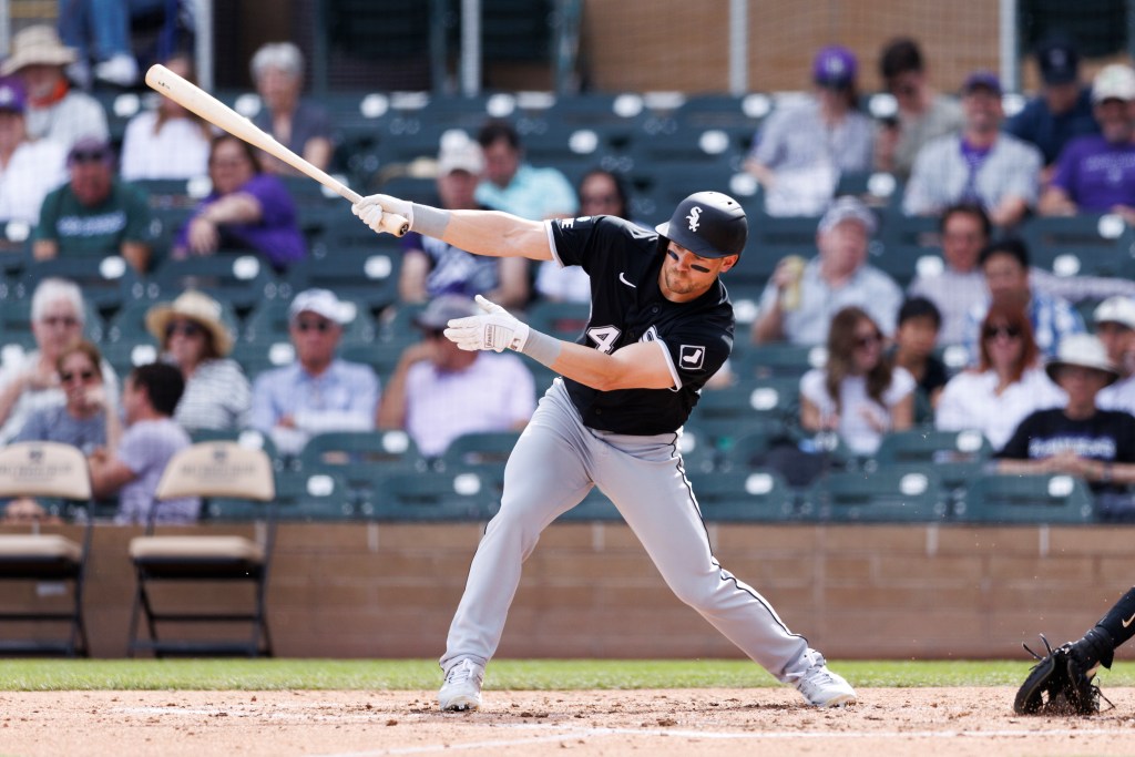 Chicago White Sox player batting during a game against the Colorado Rockies.