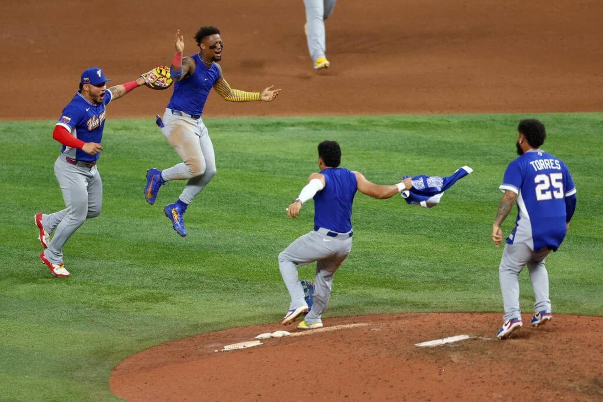 Willson Contreras, Ronald Acuña Jr., Javier Sanoja, and Gleyber Torres of Team Venezuela celebrate after the 3-2 victory against Team United States at loanDepot Park on March 17, 2026 in Miami.