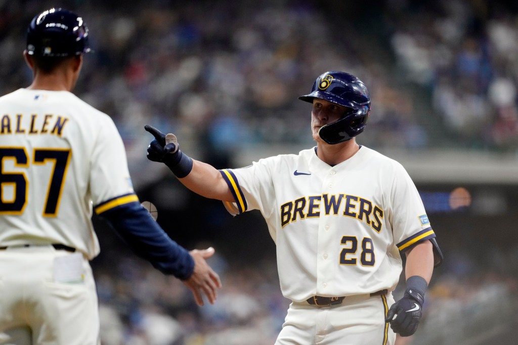 Andrew Vaughn #28 of the Milwaukee Brewers celebrates after hitting a single in the sixth inning during the game between the Chicago White Sox and the Milwaukee Brewers at American Family Field on Thursday, March 26, 2026 in Milwaukee