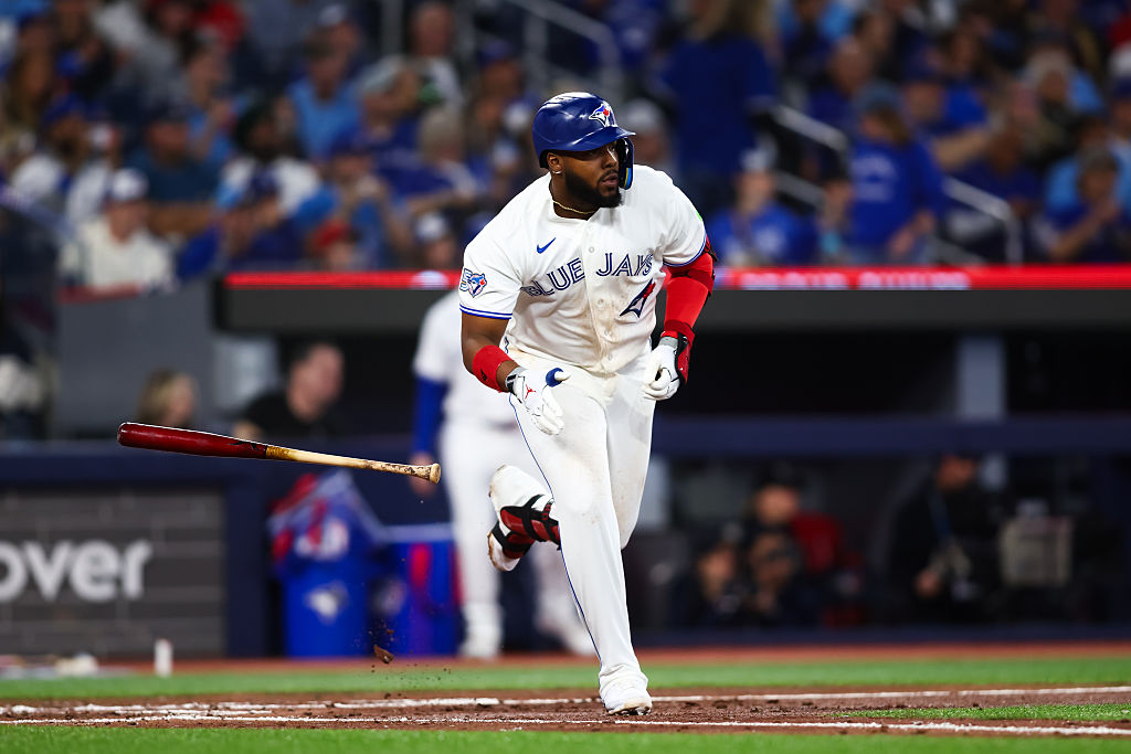 TORONTO, CANADA - MARCH 27: Vladimir Guerrero Jr. #27 of the Toronto Blue Jays throws the bat as he singles in the fourth inning of their MLB game against the Athletics at Rogers Centre on March 27, 2026 in Toronto, Ontario, Canada. (Photo by Cole Burston/Getty Images)