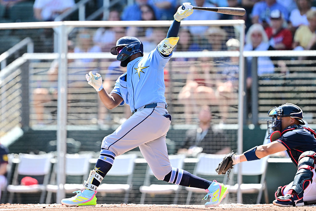 NORTH PORT, FLORIDA - MARCH 24: Junior Caminero #13 of the Tampa Bay Rays hits a single in the second inning against the Atlanta Braves during a Grapefruit League spring training game at CoolToday Park on March 24, 2026 in North Port, Florida. (Photo by Julio Aguilar/Getty Images)