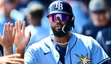 NORTH PORT, FLORIDA - MARCH 24: Junior Caminero #13 of the Tampa Bay Rays celebrates with teammates in the dugout after scoring in the second inning against the Atlanta Braves during a Grapefruit League spring training game at CoolToday Park on March 24, 2026 in North Port, Florida. (Photo by Julio Aguilar/Getty Images)