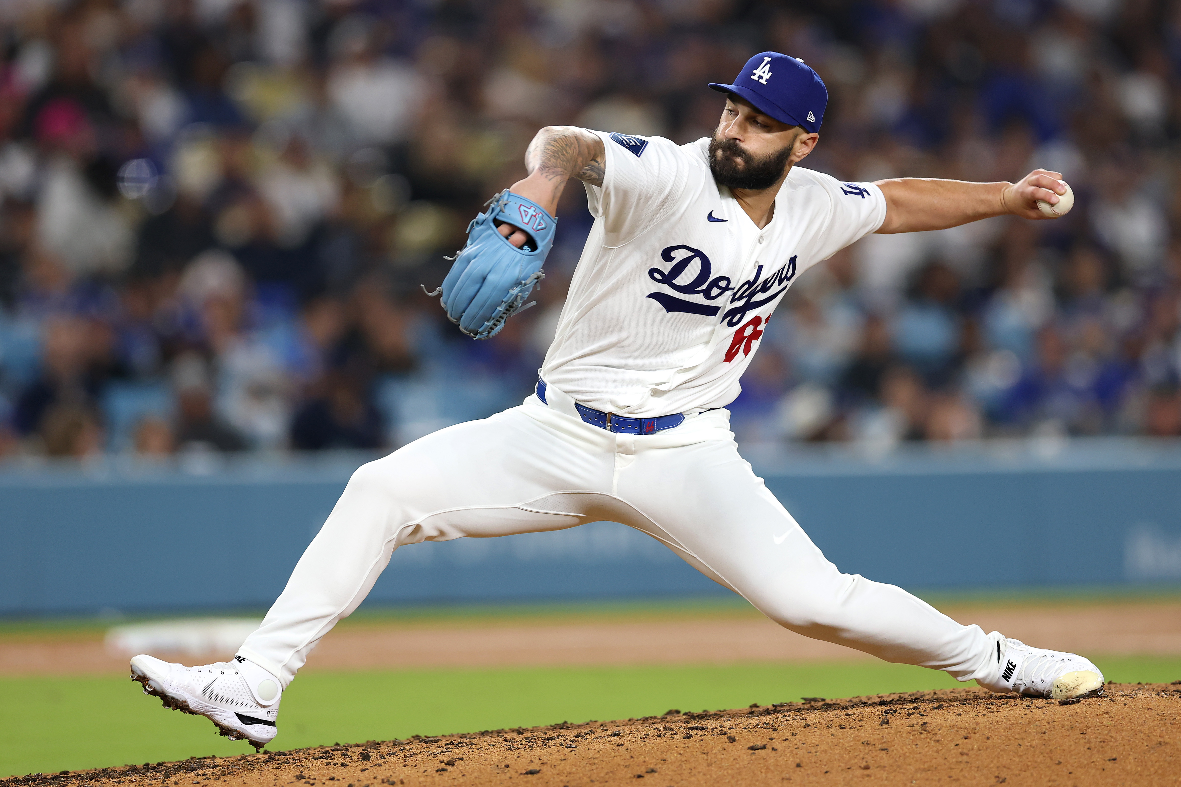 Dodgers relief pitcher Tanner Scott throws to the plate during...