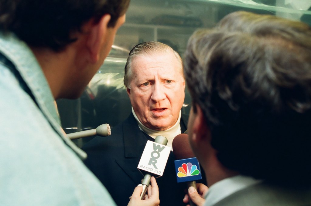 New York Yankees owner George Steinbrenner talks to the media during Game Four of the World Series against the Atlanta Braves on October 27, 1999 at Yankee Stadium in Bronx, New York.