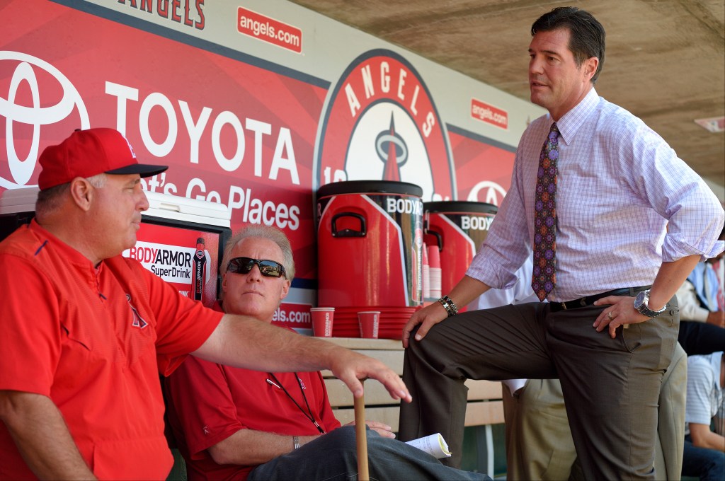 Mike Scioscia #14 of the Los Angeles Angels of Anaheim talks with sportscasters Terry Smith and Mark Gubizca before the game against the Baltimore Orioles at Angel Stadium of Anaheim on August 8, 2015 in Anaheim, California.