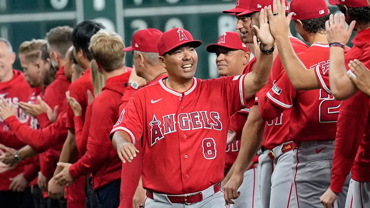Los Angeles Angels manager Kurt Suzuki (8) was introduced before Thursday's Opening Day game against the Houston Astros in Houston.