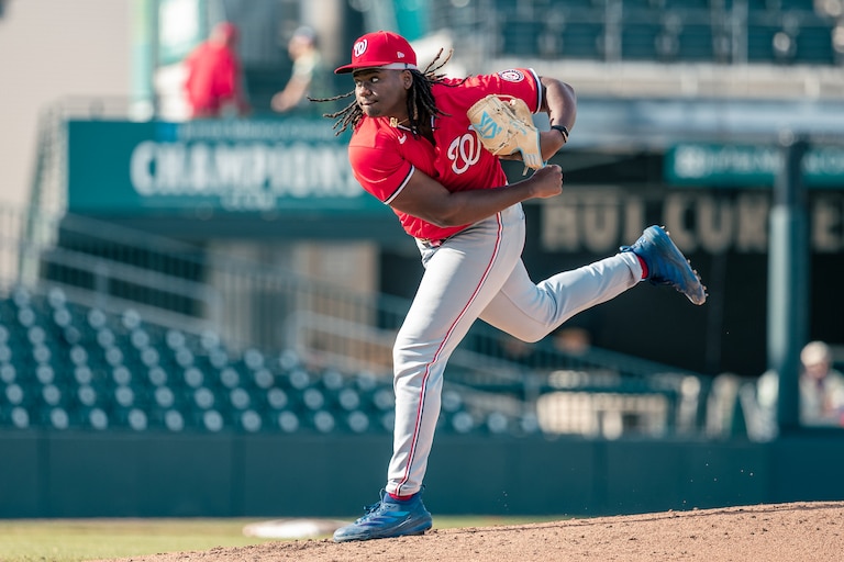 Washington Nationals pitching prospect Miguel Sime Jr. pitches during a spring training game against the St. Louis Cardinals on March 19.