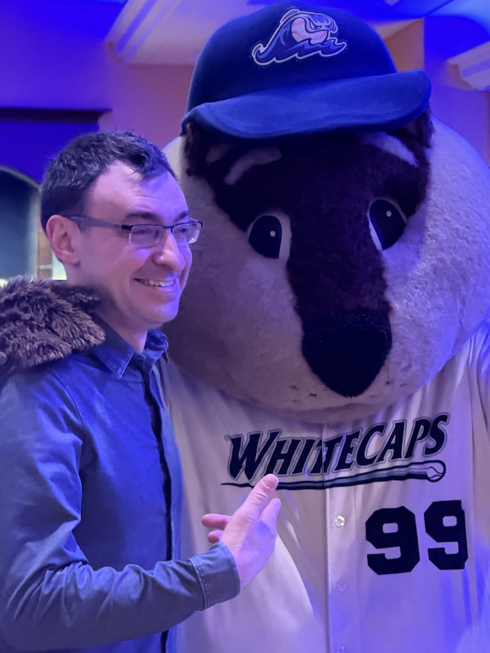Jason Benetti poses with the Whitecaps' mascot at their 2026 winter banquet