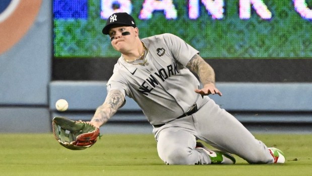 New York Yankees left fielder Alex Verdugo makes a diving catch on a ball hit by the Dodgers' Kike Hernandez (not pictured) during the ninth inning of Game 1 of the World Series on Friday night at Dodger Stadium. (Photo by Keith Birmingham, Orange County Register/SCNG)