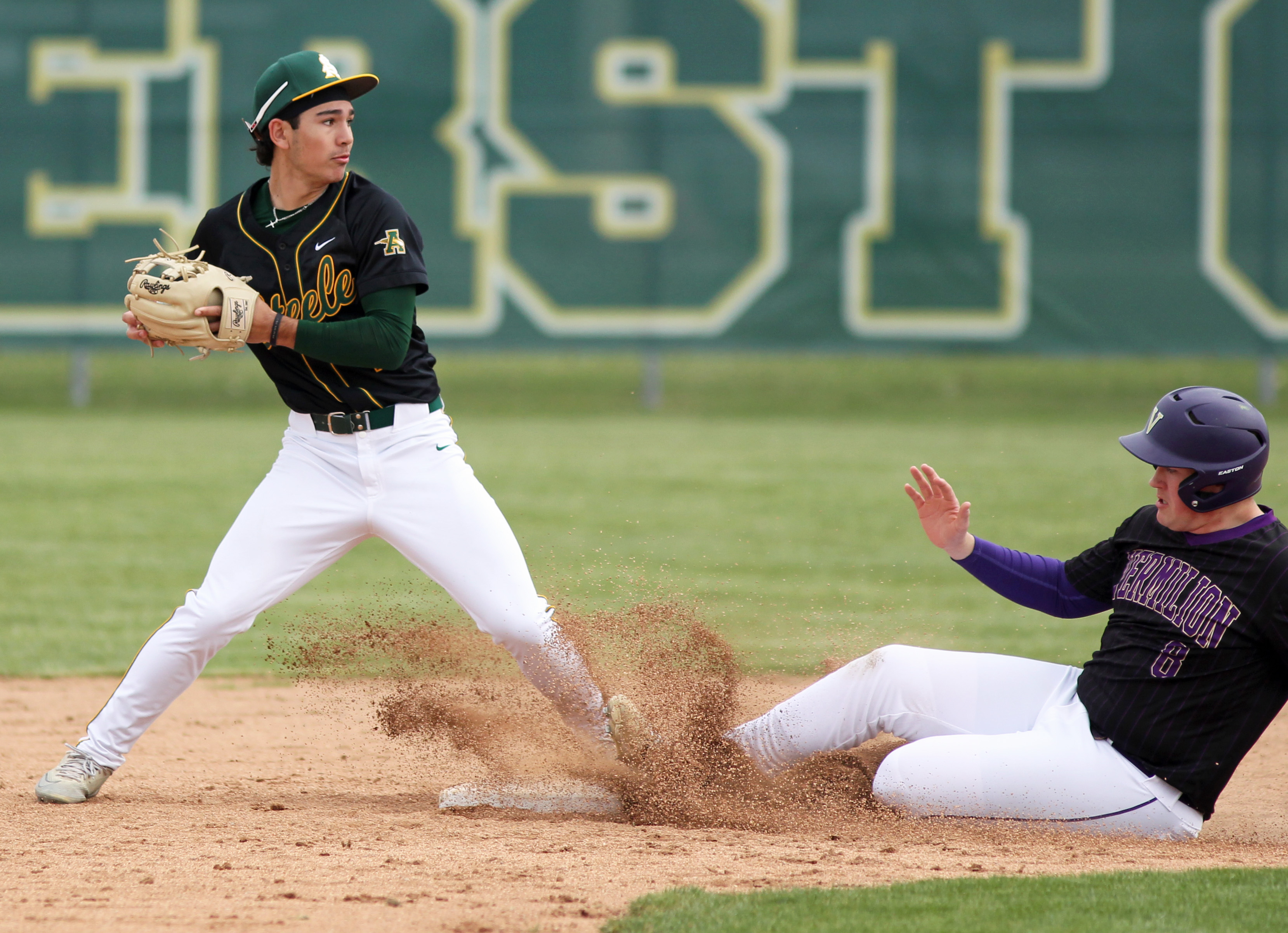 Amherst infielder Eli Toyoda gets the force out at second...