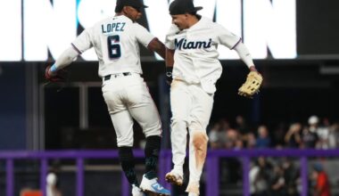 Miami Marlins players Otto Lopez and Javier Sanoja celebrate after defeating the Colorado Rockies on MLB Opening Day at loanDepot park in Miami