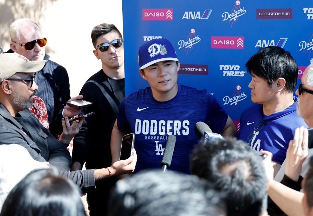 Los Angeles Dodgers pitcher Yoshinobu Yamamoto addresses the media at spring training.