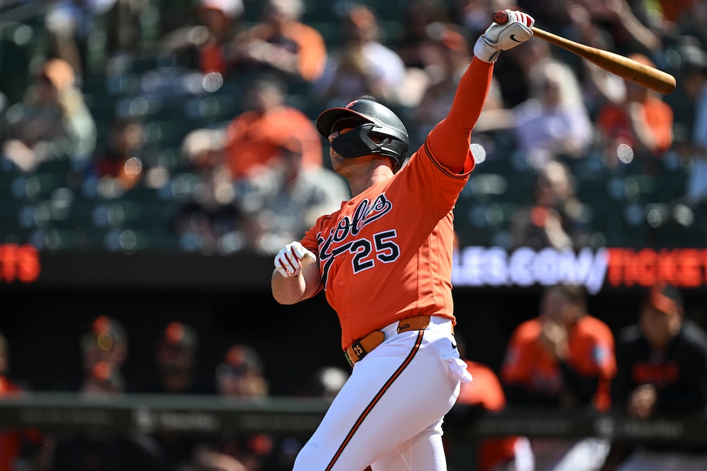 Baltimore Orioles’ Pete Alonso (25) follows through on his swing after hitting a fly ball for an out during the first inning of an exhibition baseball game against the Washington Nationals, Sunday, March 22, 2026, in Baltimore.
