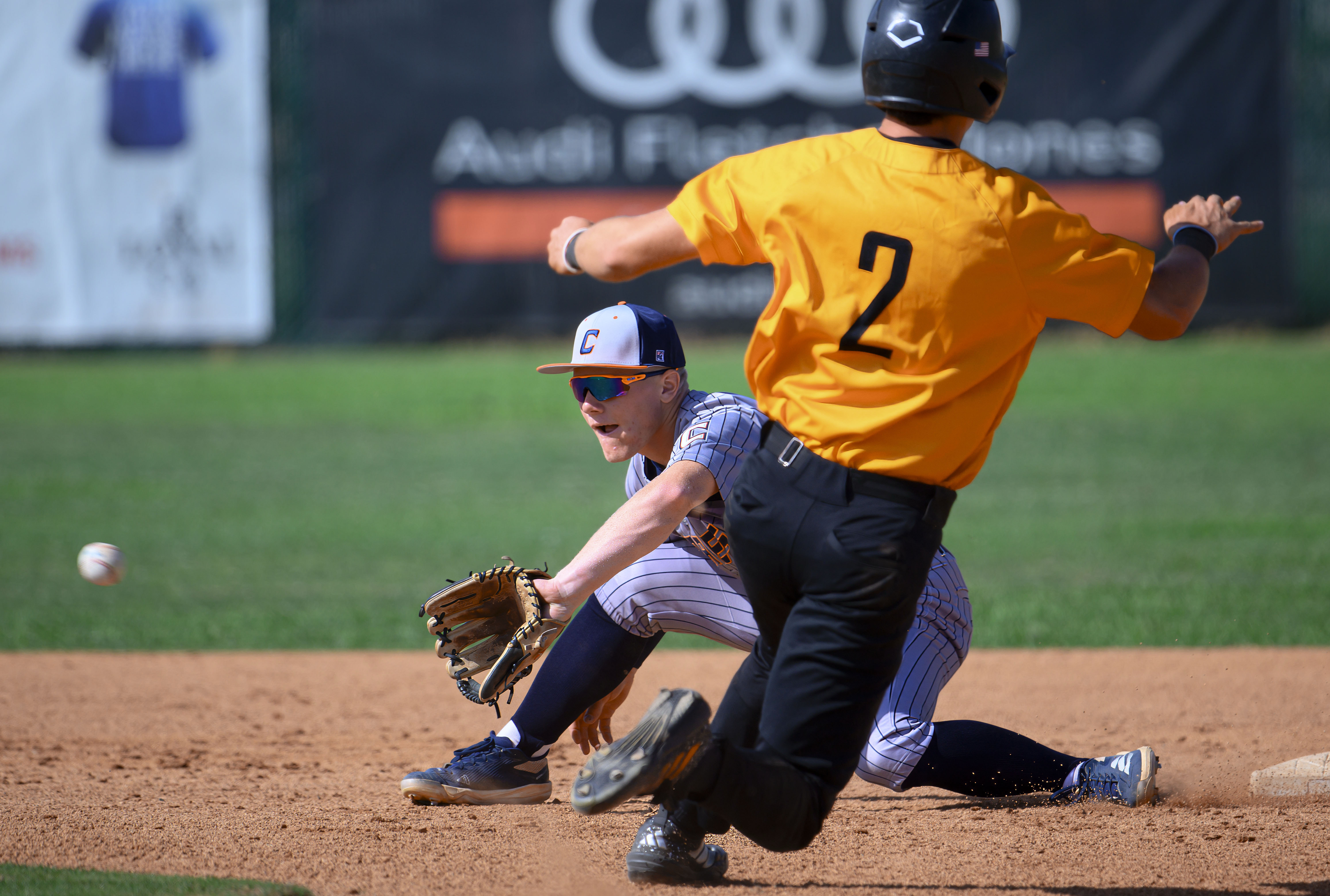 Cypress shortstop Jake de Laquil takes the throw from the...