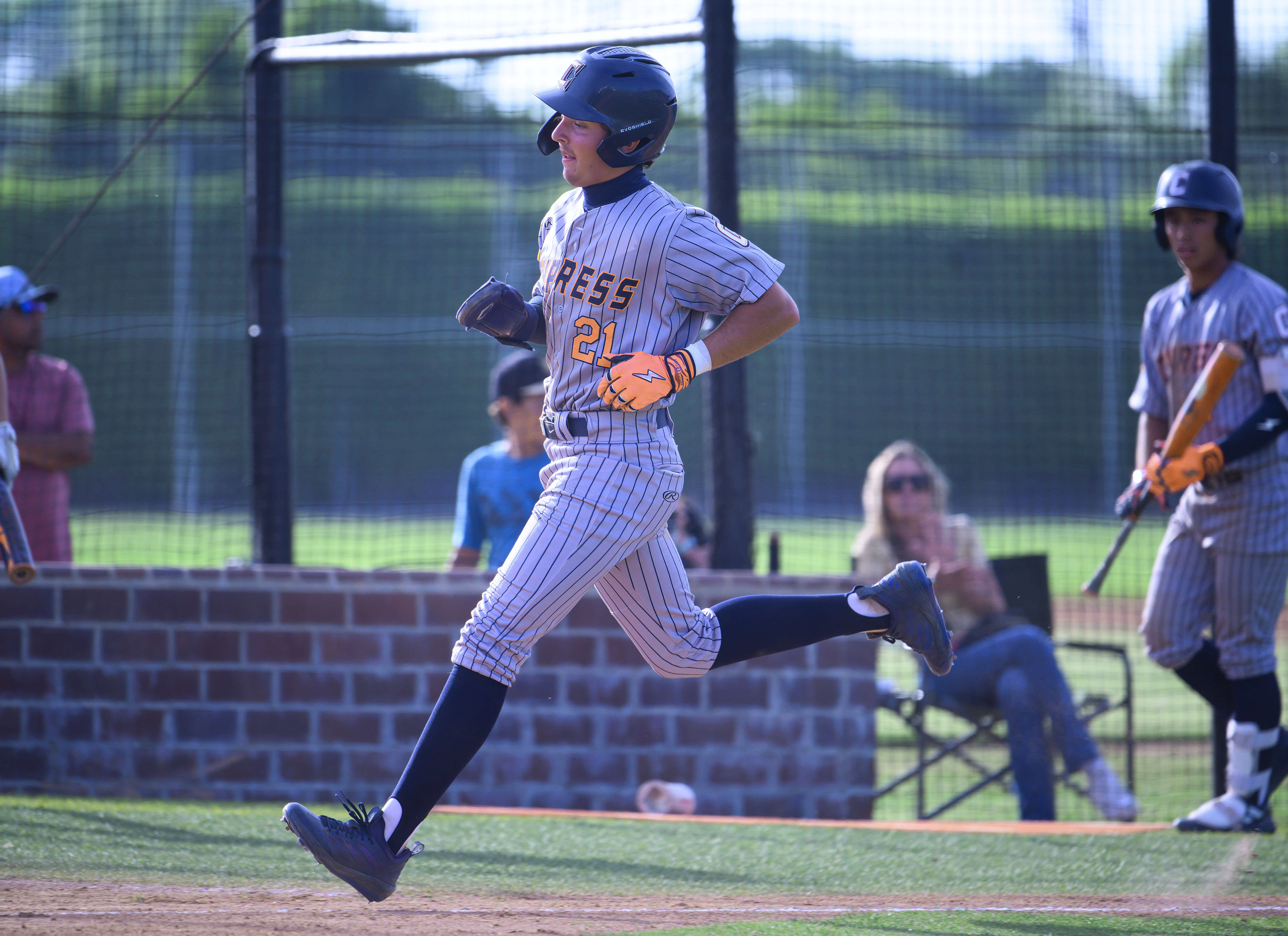 Cypress outfielder Tyler Vladic scores a run on a sacrifice...