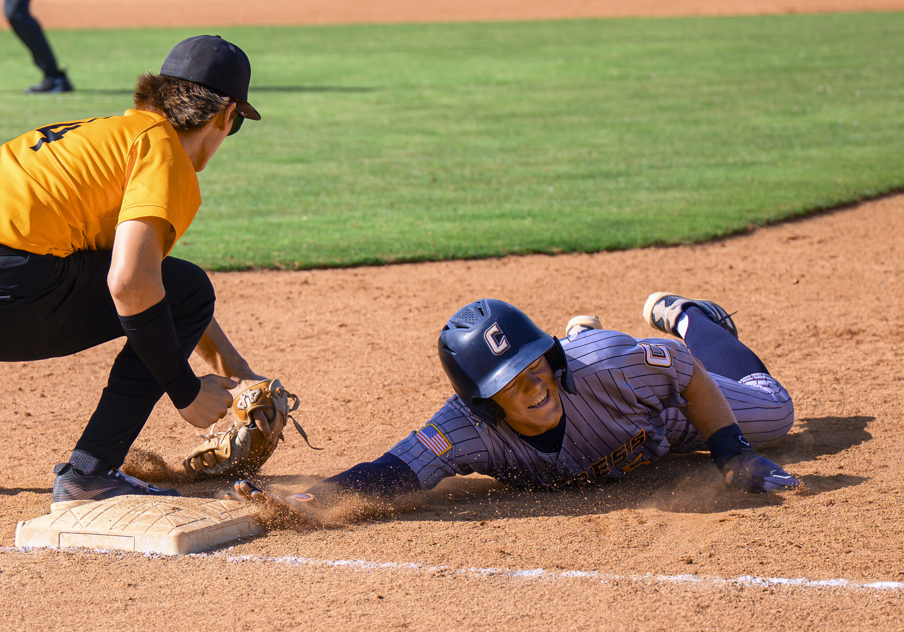 Cypress’ Jake de Laquil dives back to the bag at...