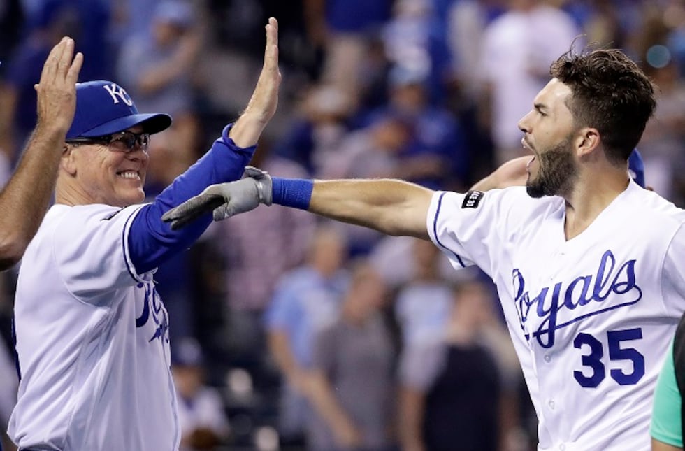 Kansas City Royals' Eric Hosmer (35) celebrates with manager Ned Yost after hitting a...