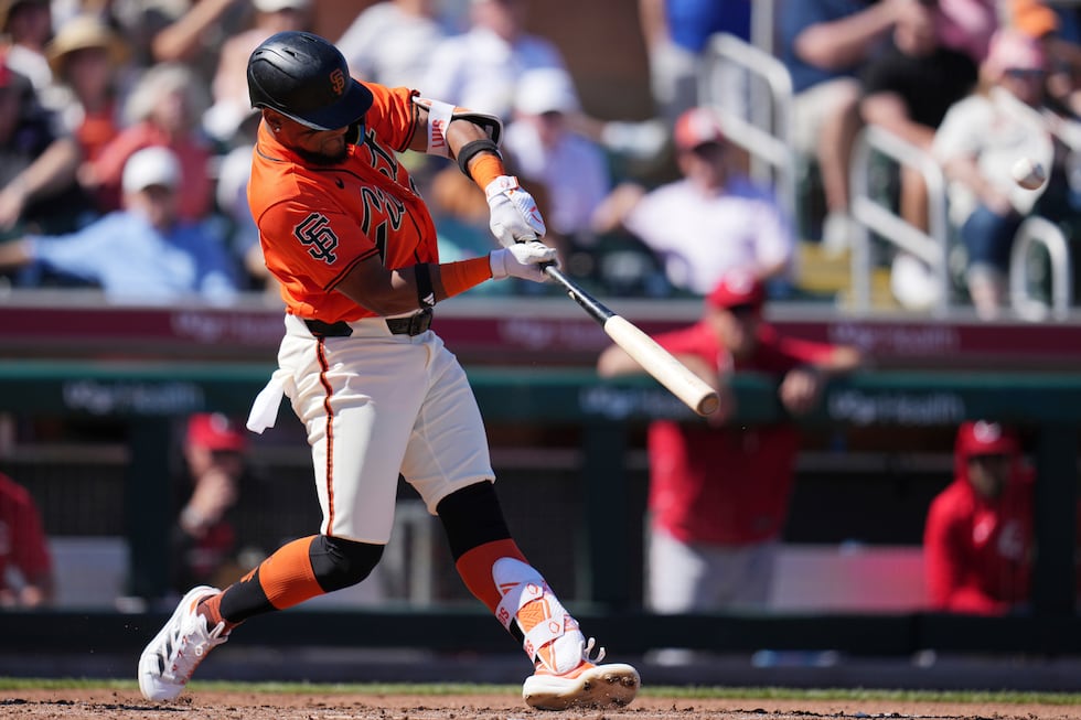 San Francisco Giants' Luis Matos connects for a run-scoring double against the Cincinnati Reds...