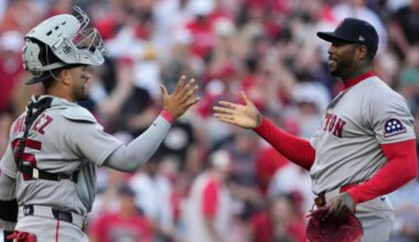 Boston Red Sox pitcher Aroldis Chapman, right, celebrates with catcher Carlos Narváez after winning an opening-day baseball game against the Cincinnati Reds in Cincinnati, Thursday, March 26, 2026.