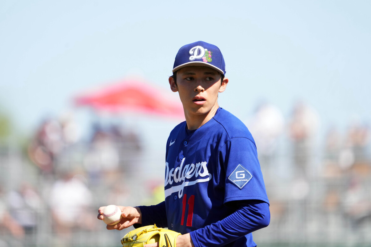 Los Angeles Dodgers starting pitcher Roki Sasaki (11) pitches against the Cleveland Guardians during the third inning at Goodyear Ballpark.