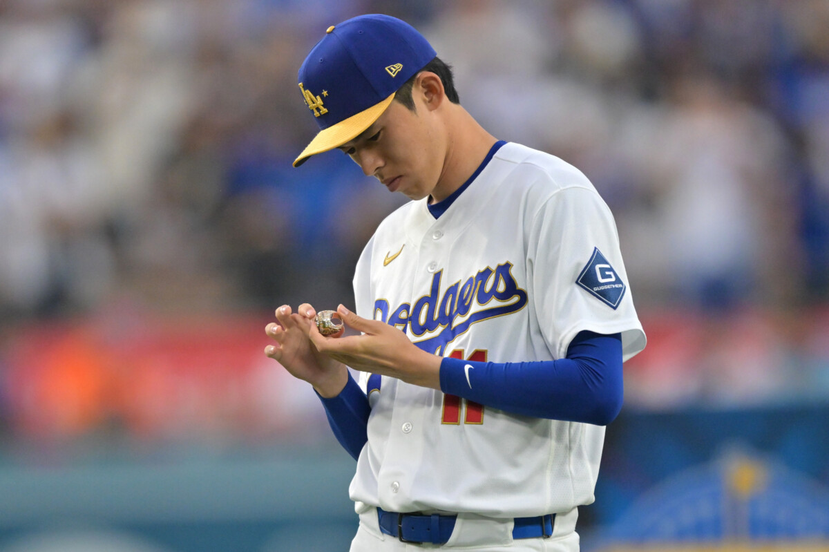 Mar 27, 2026; Los Angeles, California, USA; Los Angeles Dodgers pitcher Roki Sasaki (11) holds his ring during the World Series ring ceremony before the game against the Arizona Diamondbacks at Dodger Stadium. Mandatory Credit: Jayne Kamin-Oncea-Imagn Images