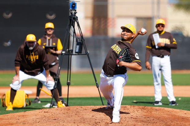 Jeremiah Estrada #56 of the San Diego Padres pitches during spring training workouts at the Peoria Sports Complex on Tuesday, Feb. 17, 2026 in Peoria, Ariz.(Meg McLaughlin / The San Diego Union-Tribune)