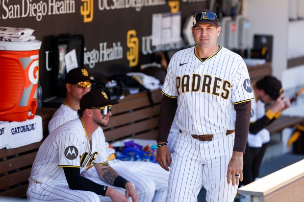 Craig Stammen of the San Diego Padres looks on in the dugout before Opening Day against the Detroit Tigers at Petco Park on Thursday, March 26, 2026 in San Diego, California. (Photo by Meg McLaughlin / The San Diego Union-Tribune via Getty Images)