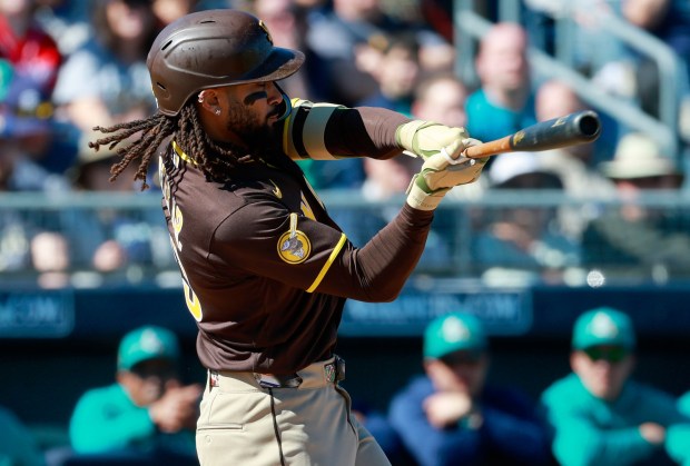 Peoria, AZ - February 20: Fernando Tatis Jr. #23 of the San Diego Padres check swings during his first at bat against the Seattle Mariners during a spring training game on February 20, 2026 in Peoria, AZ. (K.C. Alfred / The San Diego Union-Tribune)