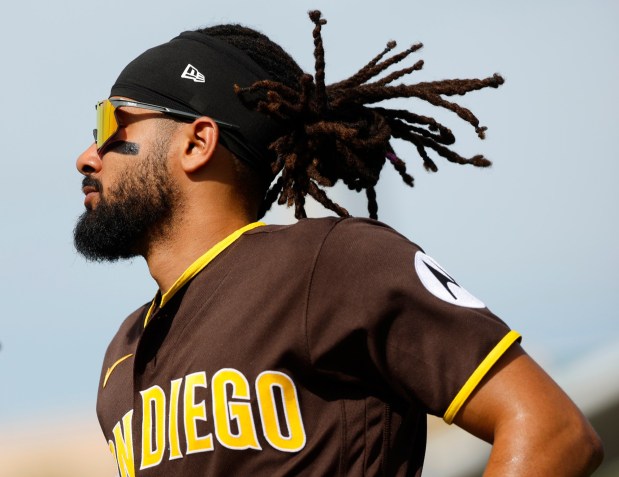 Peoria, AZ - February 23: Fernando Tatis Jr. #23 of the San Diego Padres warms up before a spring training game against the Milwaukee Brewers on February 23, 2026 in Peoria, AZ. (K.C. Alfred / The San Diego Union-Tribune)