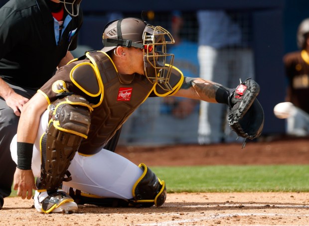 Peoria, AZ - February 23: Freddy Fermin #54 of the San Diego Padres catches a pitch during a spring training game against the Milwaukee Brewers on February 23, 2026 in Peoria, AZ. (K.C. Alfred / The San Diego Union-Tribune)