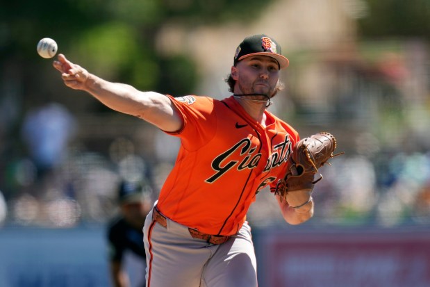 San Francisco Giants starting pitcher Landen Roupp throws against the Los Angeles Dodgers during the first inning of a spring training baseball game, Wednesday, March 18, 2026, in Phoenix. (AP Photo/Ross D. Franklin)