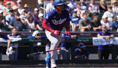 Los Angeles Dodgers second baseman Santiago Espinal hits the ball into play against the San Francisco Giants in the first inning at Scottsdale Stadium.