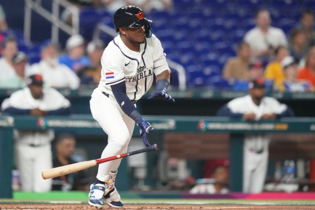 Netherlands' Ceddanne Rafaela drops his bat after hitting a single during the first inning of a World Baseball Classic game against Israel, Tuesday, March 10, 2026, in Miami. (AP Photo/Lynne Sladky)