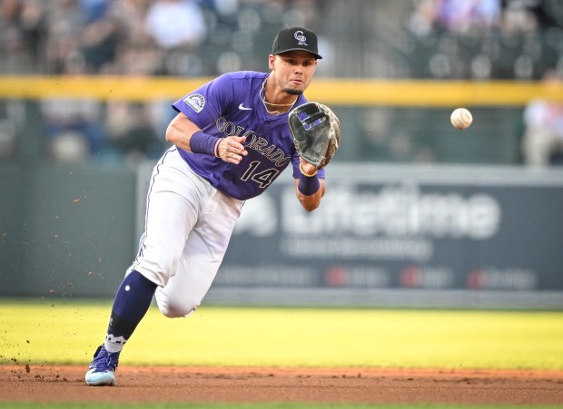 Ezequiel Tovar (14) of the Colorado Rockies fields a ball hit by Teoscar Hernández (37) of the Los Angeles Dodgers before turning two during the first inning at Coors Field in Denver on Wednesday, Aug. 20, 2025. (Photo by AAron Ontiveroz/The Denver Post)