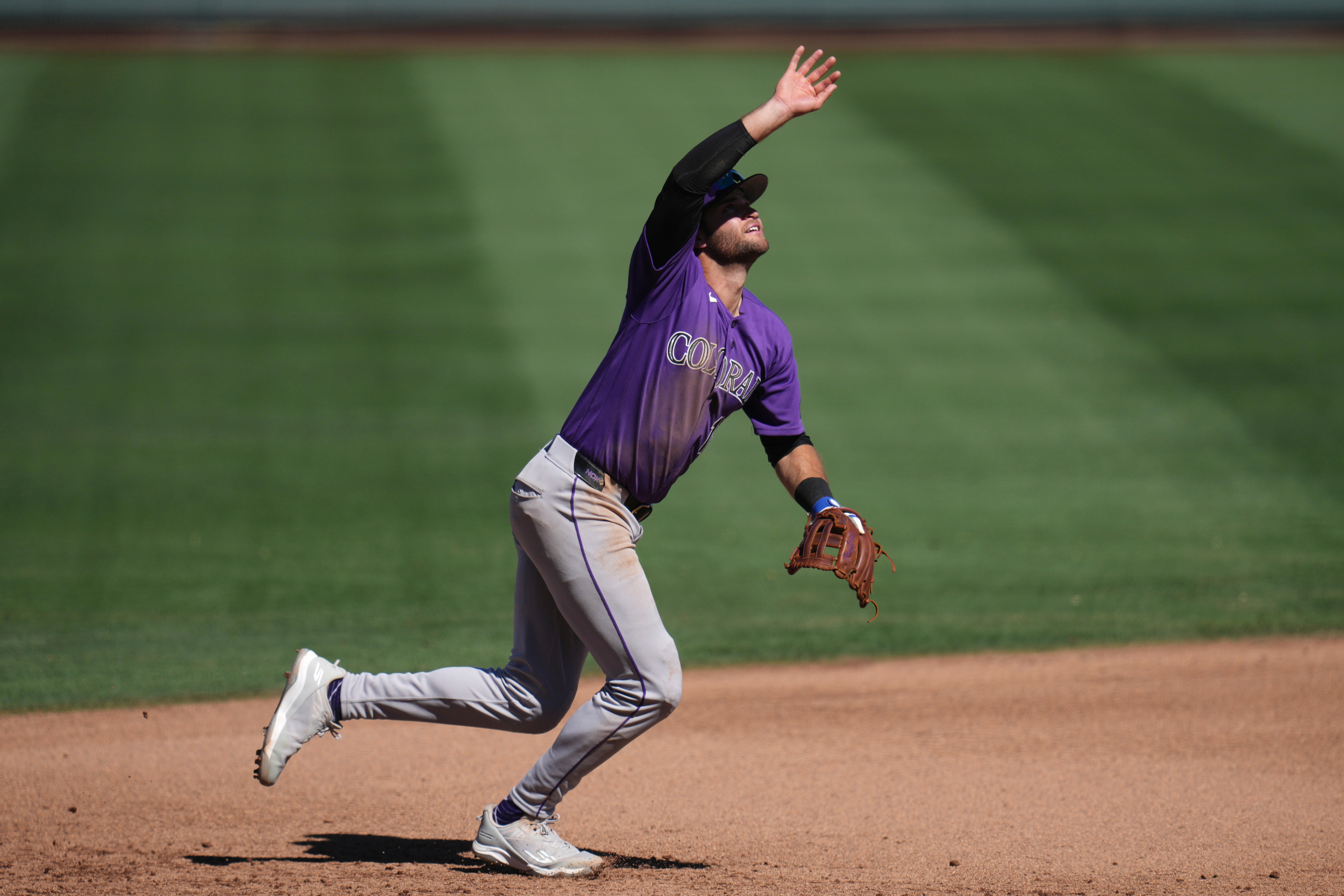 Colorado Rockies third baseman Kyle Karros tries to track down...