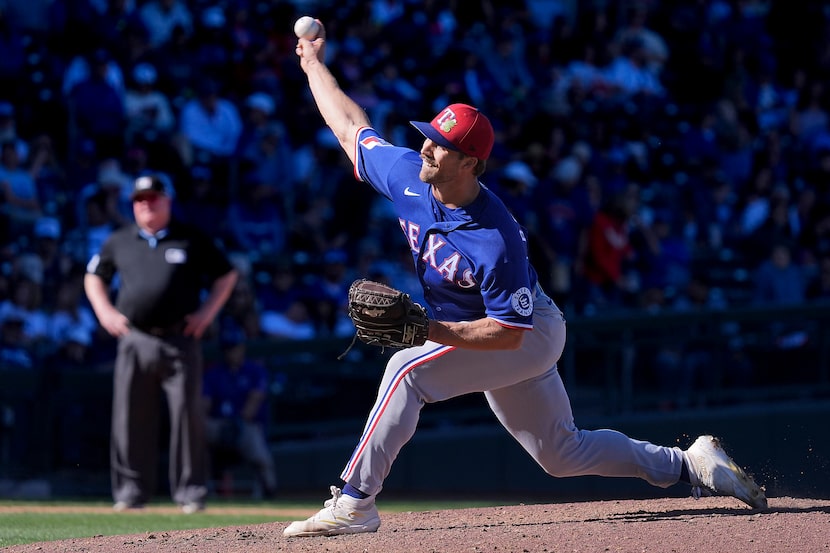 Texas Rangers pitcher Carter Baumler delivers during the seventh inning of a spring training...