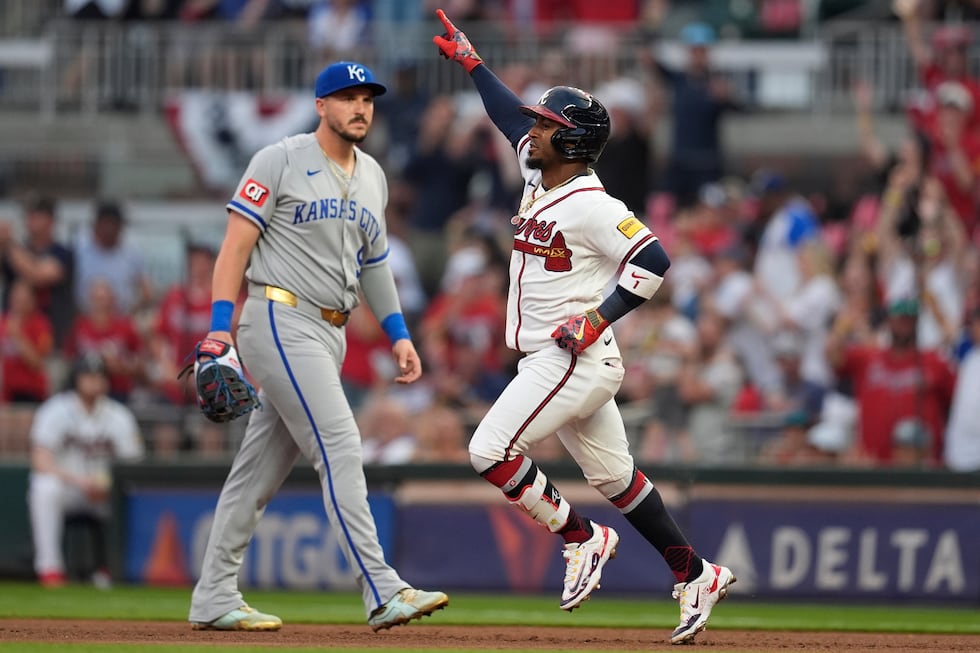 Atlanta Braves' Ozzie Albies (1) celebrates his solo homer against the Kansas City Royals...