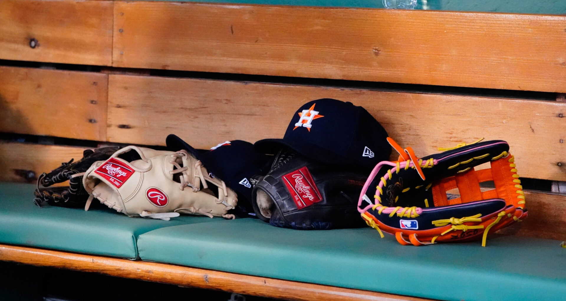 May 16, 2022; Boston, Massachusetts, USA; A general view of gloves and Houston Astros hats prior to the game against the Boston Red Sox at Fenway Park.
