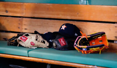 May 16, 2022; Boston, Massachusetts, USA; A general view of gloves and Houston Astros hats prior to the game against the Boston Red Sox at Fenway Park.