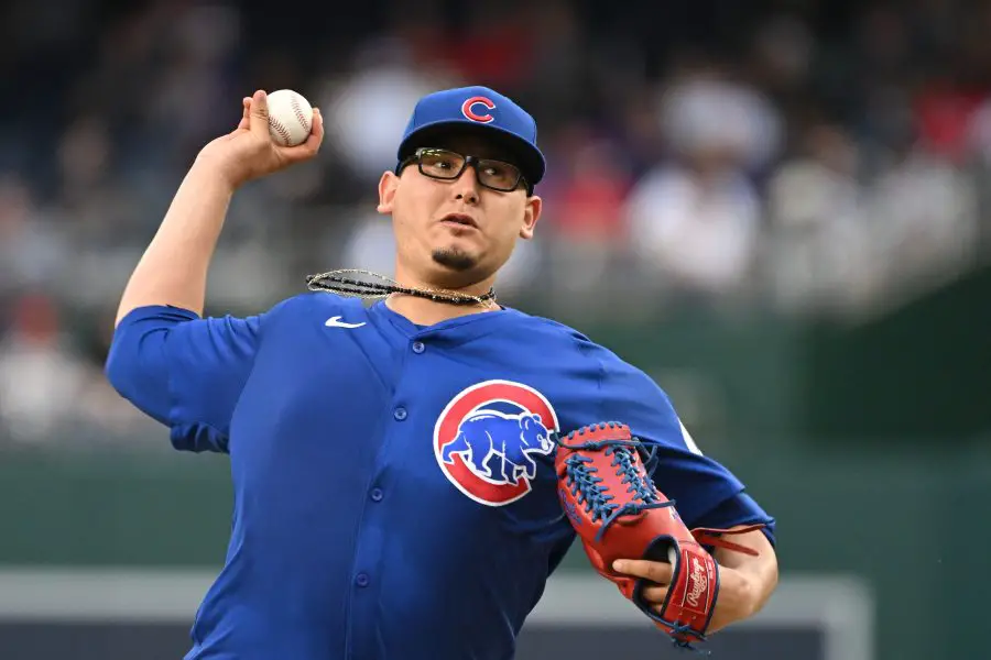 Chicago Cubs starting pitcher Javier Assad (72) throws a pitch