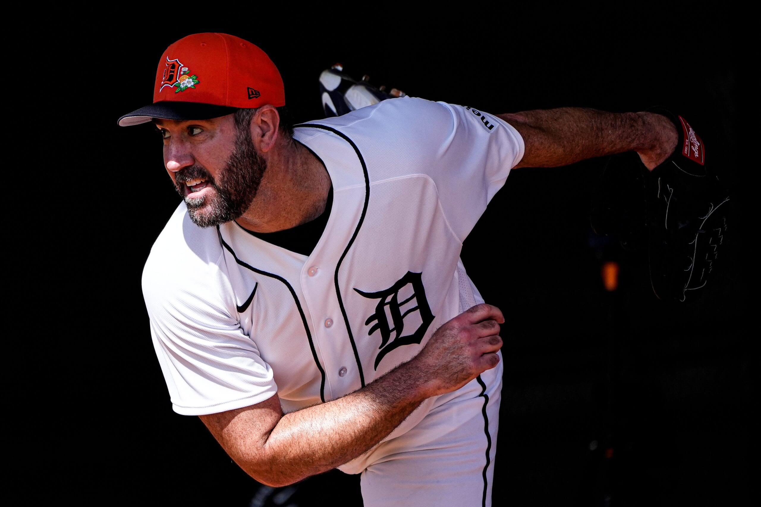 An image of Detroit Tigers pitcher Justin Verlander at the end of his pitching motion, after releasing the baseball.