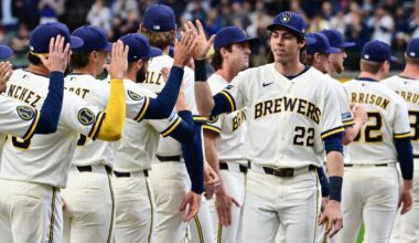 Mar 26, 2026; Milwaukee, Wisconsin, USA; Milwaukee Brewers designated hitter Christian Yelich (22) greets teammates during team introduction before Opening Day against the Chicago White Sox at American Family Field. Mandatory Credit: Benny Sieu-Imagn Images