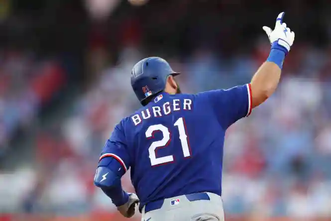 Mar 26, 2026; Philadelphia, Pennsylvania, USA; Texas Rangers first baseman Jake Burger (21) runs the bases after hitting a two RBI home run during the ninth inning against the Philadelphia Phillies at Citizens Bank Park. Mandatory Credit: Bill Streicher-Imagn Images