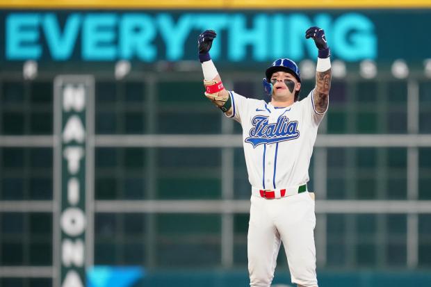 Italy's Andrew Fischer celebrates after hitting a two-run double during the fourth inning of a World Baseball Classic quarterfinal against Puerto Rico on Saturday, March 14, 2026, in Houston. (Karen Warren/AP)