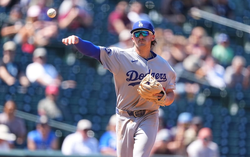 Baseball player throwing a pitch.