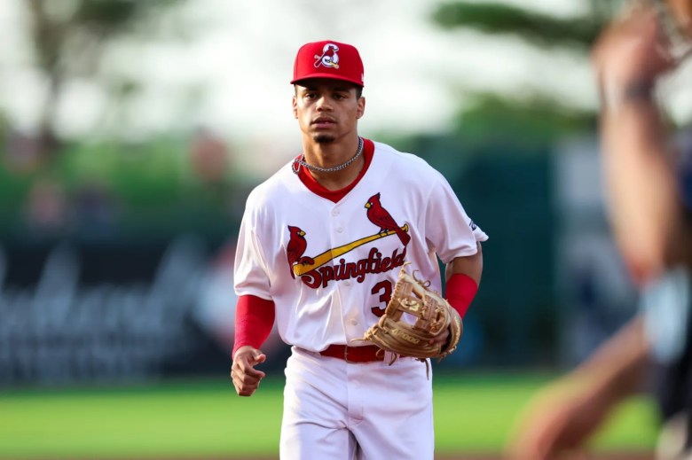 Masyn Winn, wearing a Springfield Cardinals baseball uniform, runs off the field at the end of an inning during a game at Hammons Field.